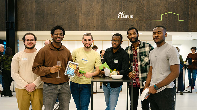 group of colleagues behind pc